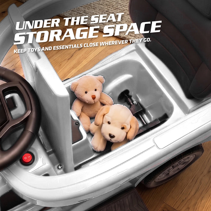 Open under-seat storage in a white Ford F-150 Raptor kids' ride-on push car, holding small toys and plush animals.