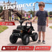 Child standing beside a black Ford F-150 Raptor 12V kids' ride-on ATV to show the vehicle's size and proportions.