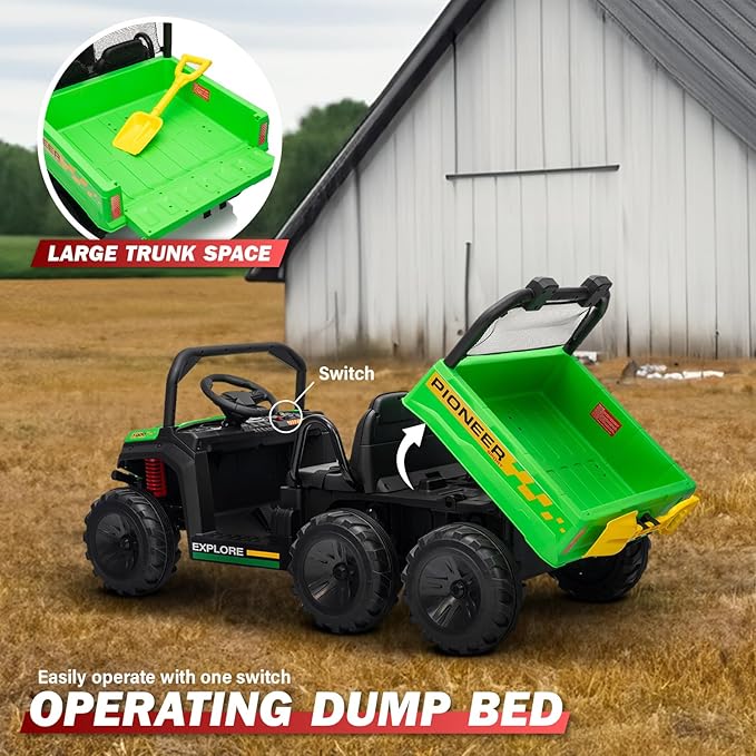Toy dump truck with green bed and black chassis in front of a barn.