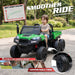 Child riding the green 24V farm truck with suspension for a smoother outdoor ride