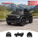 Black ride-on toy car styled like a Land Rover Defender, shown outdoors on a gravel path with mountain scenery in the background. White dimension lines and text indicate the toy's measurements: 98 cm length, 56 cm width, and 47 cm height. Black Land Rover Defender 110 ride-on car dimensions and exterior views