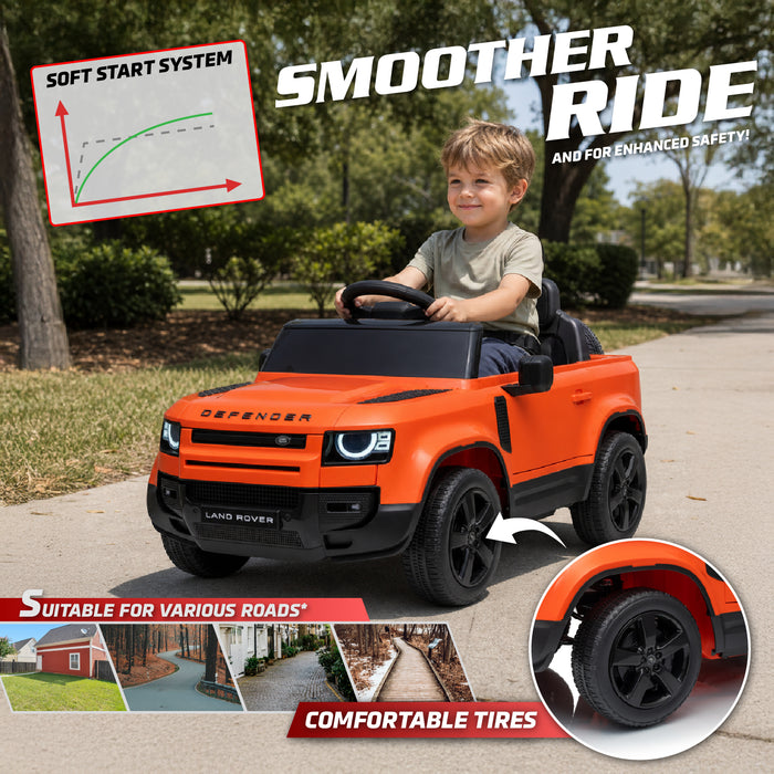 A child driving an orange and black Land Rover Defender-style ride-on toy car on a paved outdoor path. The image includes marketing text such as 'SMOOTHER RIDE' and feature callouts like 'SOFT START SYSTEM,' 'SUITABLE FOR VARIOUS ROADS,' and 'COMFORTABLE TIRES,' plus a wheel close-up inset. Land Rover Defender 110 kids electric car with soft start and comfortable tires
