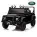 A black 4-wheel electric ride-on toy vehicle designed to look like a Land Rover Defender, shown from a three-quarter front angle on a white background with a reflection. A green Land Rover logo badge is visible in the top right corner.