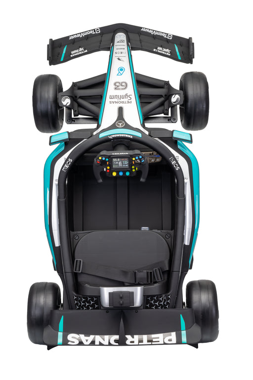 A top-down view of a Peter Dumas Mercedes F1 race car, featuring a black, white, and teal color scheme with visible sponsor logos and the number 69.