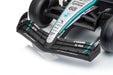 Officially licensed Mercedes-AMG PETRONAS F1 W16 kids ride-on car in team livery Close-up studio shot of a Formula 1 front wing and wheel area on a Mercedes-AMG Petronas car, showing black, silver, and teal livery with visible sponsor logos including Petronas, IWC, and Ecko.