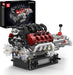 Model engine kit with detailed components and a box in the background