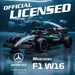 Official licensed Mercedes F1 W16 Formula 1 car in a dark teal and black livery, shown in a dramatic studio setting with other cars blurred in the background. Large text reads 'OFFICIAL LICENSED' and 'Mercedes F1 W16' with the Mercedes star logo and AMG Petronas branding Officially licensed Mercedes-AMG PETRONAS F1 W16 kids electric ride-on car 