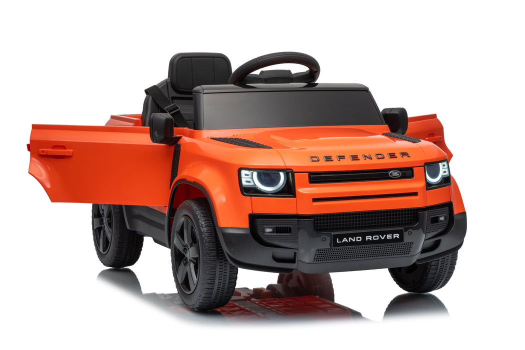 An orange and black ride-on toy car designed to look like a Land Rover Defender, shown from a three-quarter front angle on a white background. Orange Land Rover Defender 110 kids ride-on car product view