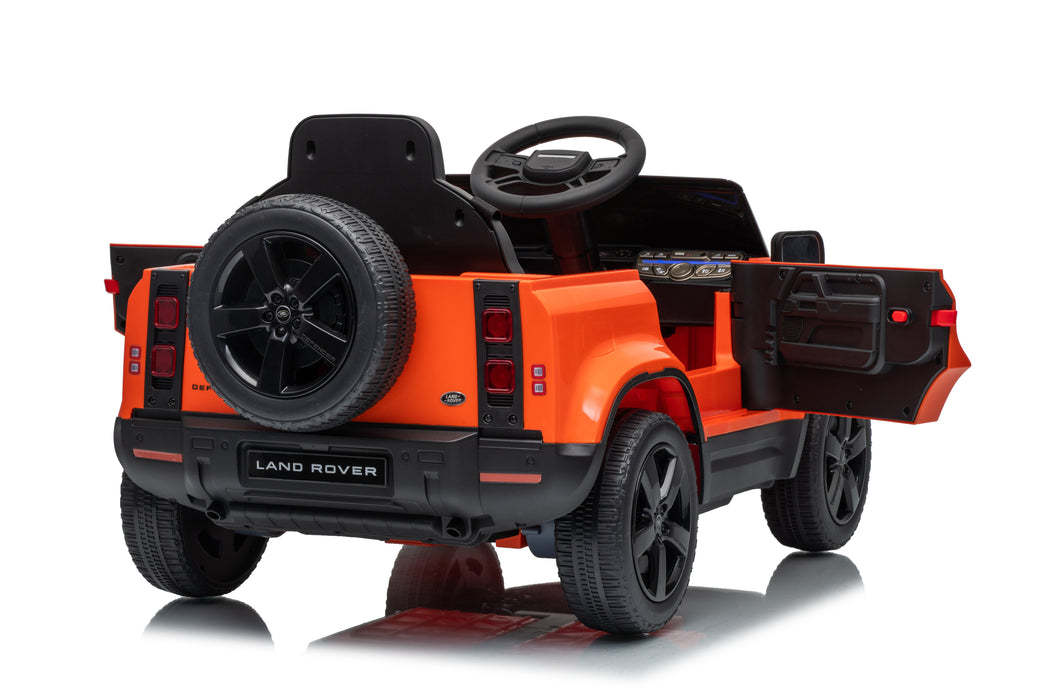 Rear and underside view of orange Land Rover Defender 110 ride-on car